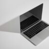 macbook pro on white table