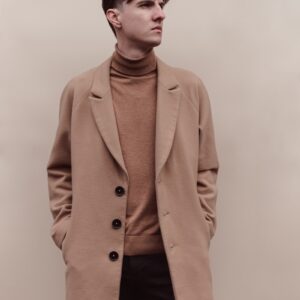 man in brown coat and black pants